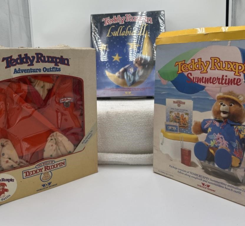 Group of Teddy Ruxpin outfits, lullabies and