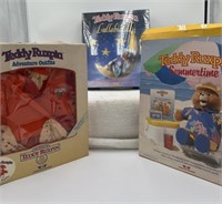 Group of Teddy Ruxpin outfits, lullabies and