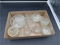 Grouping of clear glass cups and candy dish