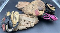 Group of 6 baseball gloves including catchers