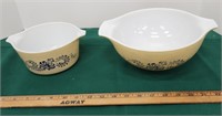 2 tan pyrex bowls