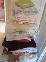 STACK OF LINNEN LOT QUILT, TABLE CLOTHES, & MORE