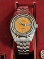 Seiko Women's Orange Face, runs