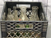 Crate filled with vintage bottles