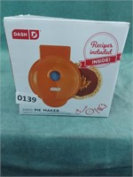 Dash 4" mini pie maker in orange. It comes