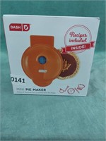 Dash 4" mini pie maker in orange. It comes