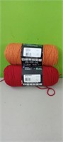 (2) Rolls of yarn...Burgundy  & carrot colors