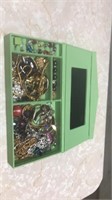 Green box of jewelry