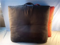 Outdoor cushions 2 black and 2 red. 23 x 23