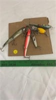 Fishing lures with treble hooks.
