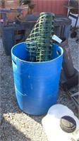 PLASTIC BARREL AND SNOW FENCE