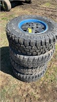 Stack of four tires 31 x 10 1/2 or 15 LT