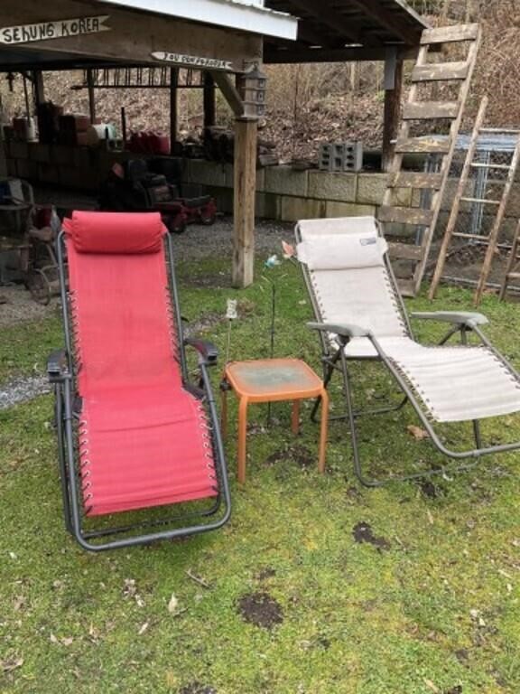 Two lawn chairs, long table, and 2 yard