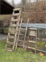 Three wooden ladders