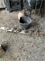 Animal traps, piece of driftwood and bucket