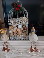 3 pieces pelicans and a metal piece with shells