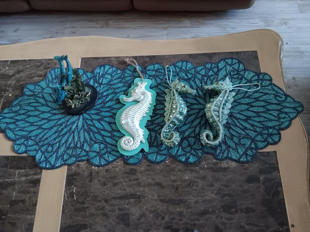 Box of seahorse ornaments, table runner and more.