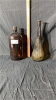 Amber glass bottle and ribbed glass vase