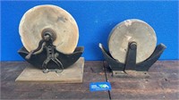 2 ANTIQUE GRINDING STONES ON CAST IRON BASES