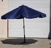 Pair of outdoor umbrellas with stands