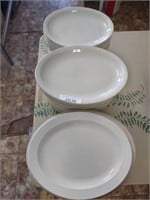 3 stacks of white restaurant plates