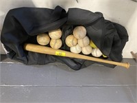 BAG OF SOFTBALLS & WOODEN BASEBALL BAT