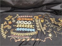 Costume jewelry.   Bracelets: cuff, charm and