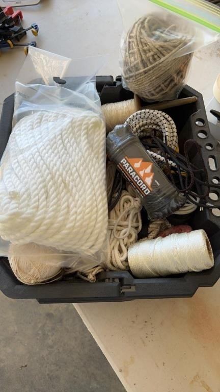 Plastic tote full of ropes,paracord, string and