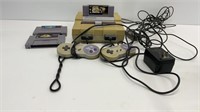 Super Nintendo with (2) controllers and (3)