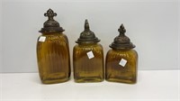 Amber colored flashed glass canisters, sizes