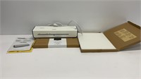 Amazon basics laminator with 2 boxes of letter