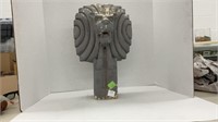Ceramic stylized lion head on pillar