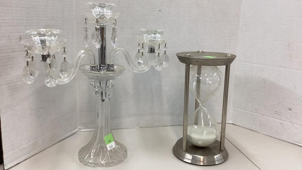 Huge hourglass timer in metal stand and 3 candle