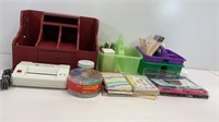 Office supplies- desk caddy’s, laminator, sequin