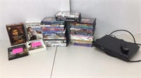 DVD/Blu-Ray Disc player (powers on) with lot of