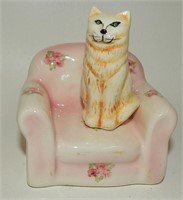 Yellow Ginger Cat on Pink Floral Armchair