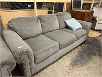 Grey upholstered couch