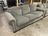 Grey upholstered couch