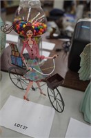 metal earring hanger-woman on bicycle, 13" tall