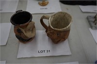 2-handmade pottery face mugs