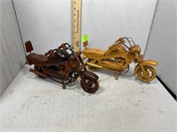 Two wooden carved motorcycles