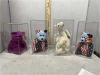 Four Beanie Babies in clear cases including 2000