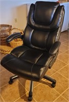 Black office chair - small wear mark on front