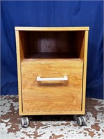 Wood tone file cabinet one drawer