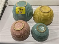 SET OF NESTING MCCOY MARKED COLORED POTTERY BOWLS