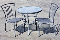 Pair of patio chairs and glass table