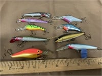 Assorted crank baits, Black and gold lure has a