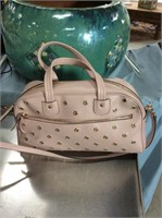 Pink handbag with grommets