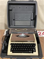 Brother portable electric typewriter in case.