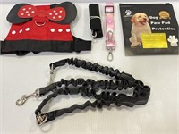 Lot of dog leashes, harness and paw pad protection